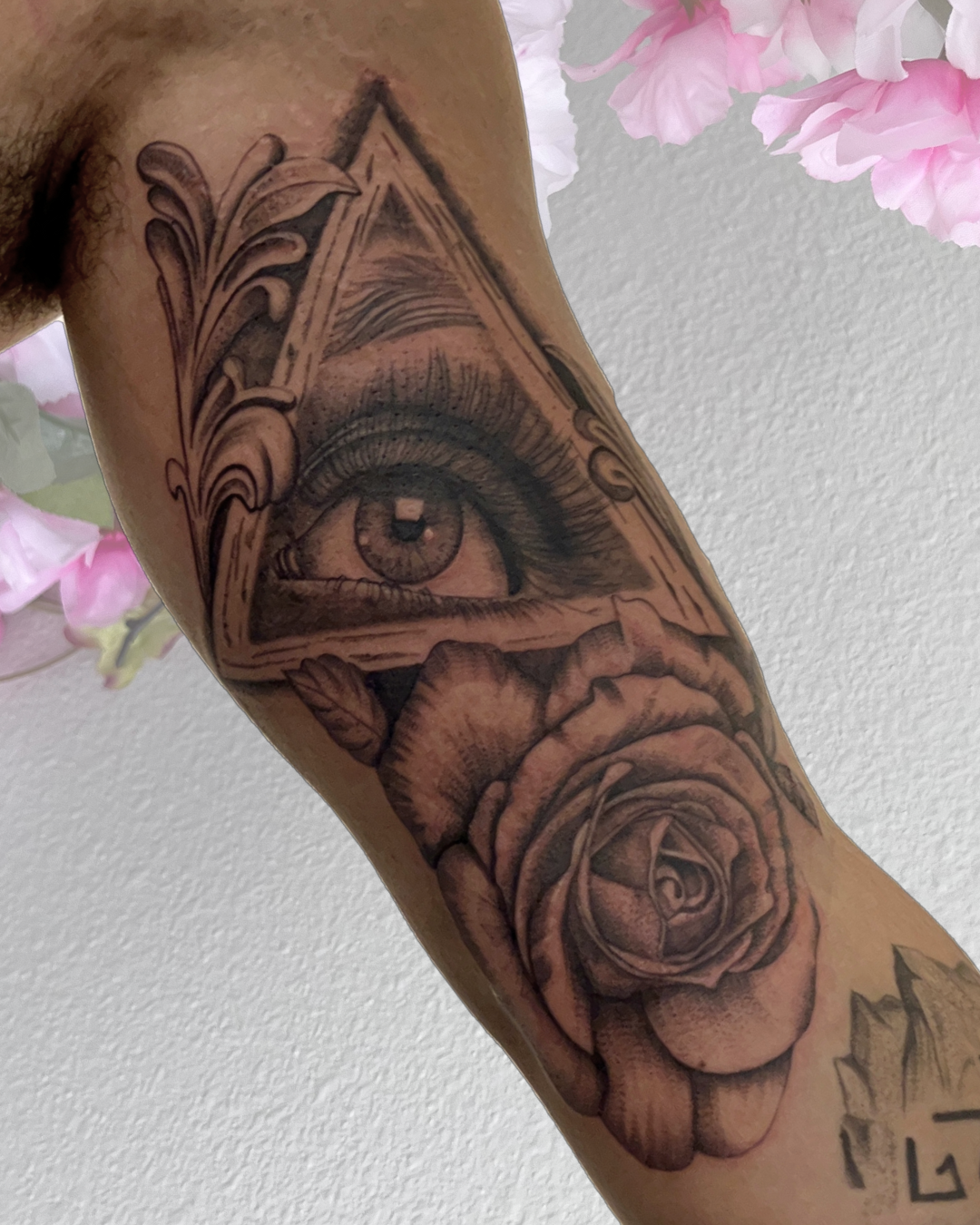 Black and grey eye, triangle and rose forearm piece