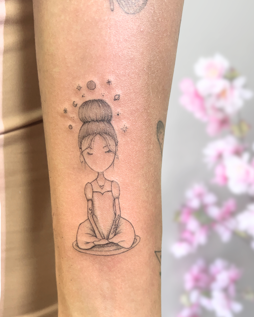 Fine line meditating figure with cosmos